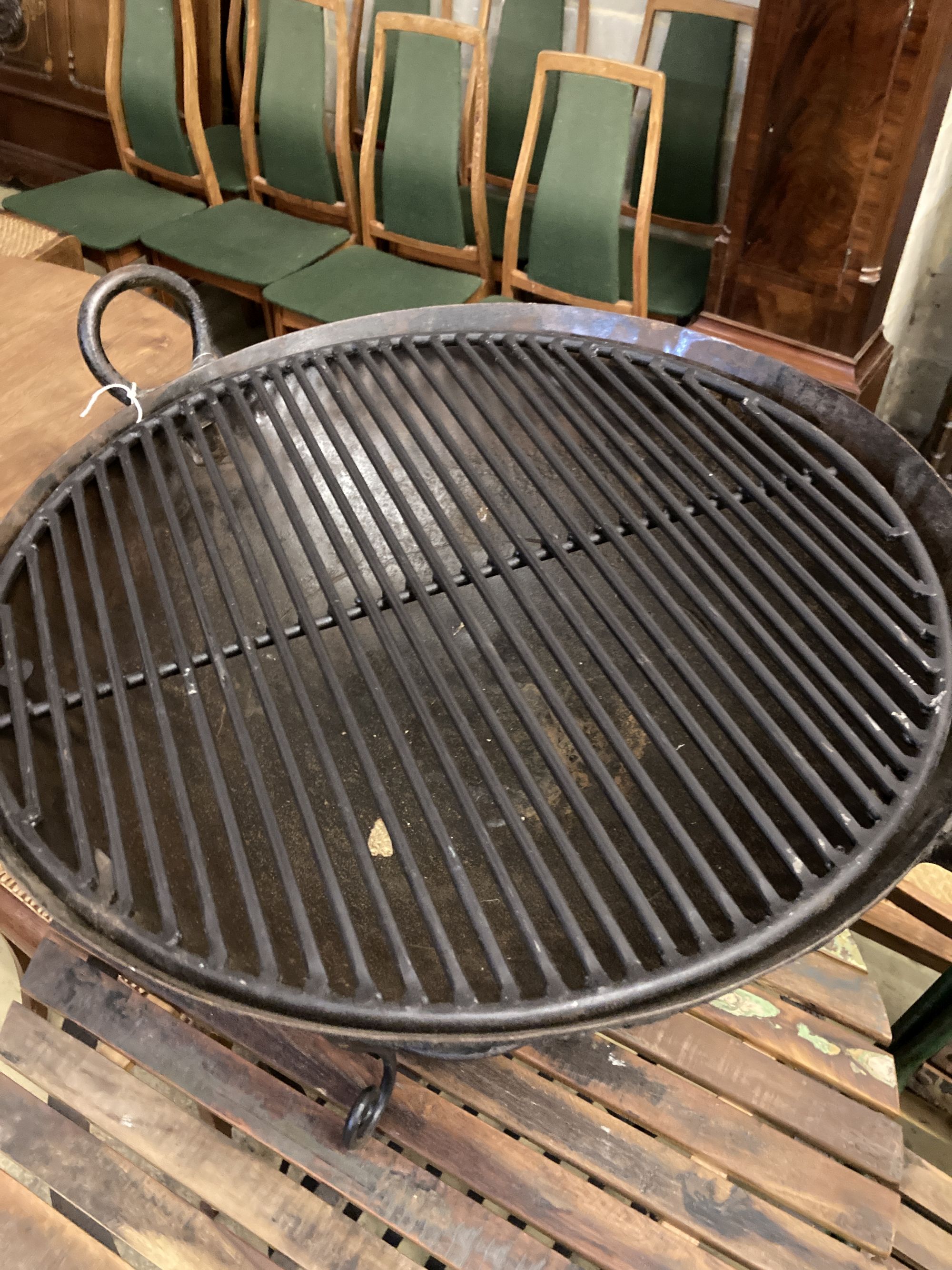 A circular wrought iron fire pit, 72cm diameter, height 54cm